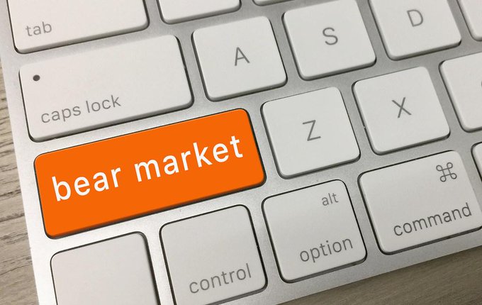 A close-up of an Apple keyboard featuring a custom orange key labeled "bear market" where the caps lock key would normally be, surrounded by standard keys like tab, option, command, and letters. The image metaphorically relates to the post by illustrating a "bear market" scenario, hinting at potential downturns or caution regarding Ethereum's blob space fees and L2 demand.