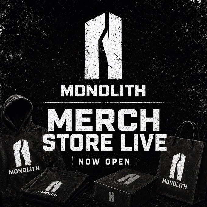 The image is a promotional graphic announcing the launch of the "MONOLITH Merch Store," featuring the brand's cracked monolith logo against a dark, grungy background. It showcases merchandise items—a hoodie, t-shirt, box, and shopping bag—all branded with the Monolith logo, visually reinforcing the post's announcement that the storefront is now open with XRP payment integration.