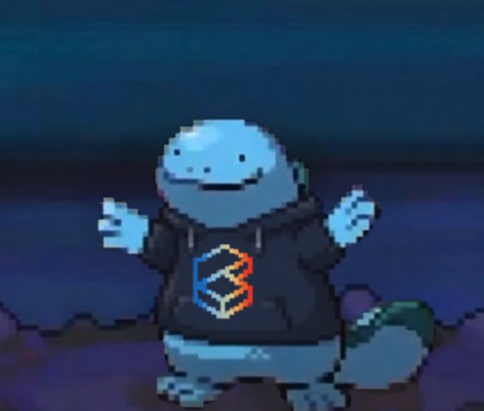 A blue cartoon lizard-like character wearing a black hoodie with a colorful geometric logo stands in a dark environment.