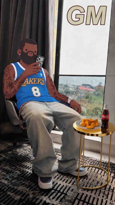 The image features a man sitting down with his legs crossed, wearing a blue basketball jersey and gray pants. He has tattoos on his arms and is holding a cell phone up to take a picture of himself. There are two bottles nearby - one containing Coca Cola and another having a plate of food. The background shows a window overlooking the cityscape, suggesting that he might be in an urban setting or at least near some buildings.