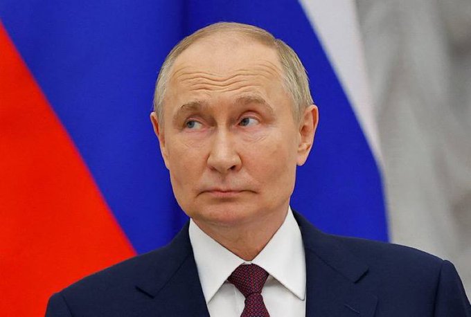 The image shows a man with a serious expression, who appears to be a government official of some sort looking off to the side. While the name isn't mentioned in the provided text, the location does give more context to the scene. The post announcing the approval of the crypto bill is most likely connected with this individual. The caption: “RUSSIAN TRADER REPORTS EMOTIONAL RELIEF AFTER OFFICIAL APPROVAL OF CRYPTO BILL”. Not included in the photo is the actual bill, but the posted data would lead to some excitement from many traders.