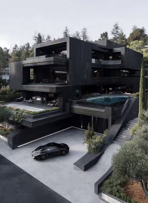 A modern, multi-level luxury mansion with a dark black exterior featuring an infinity pool, spacious terraces, and a sleek sports car parked in the driveway, surrounded by trees.