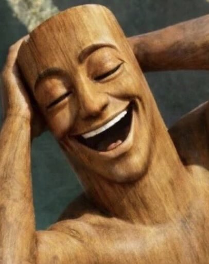 A wooden carved figure with a wide, joyful smile holds its head in its hands, embodying overwhelming happiness. The exaggerated expression of euphoric bliss humorously reflects the post's caption about the bliss of reaching a "3 figure salary"—capturing that overjoyed, head-in-hands feeling of finally crossing a small but meaningful financial milestone.