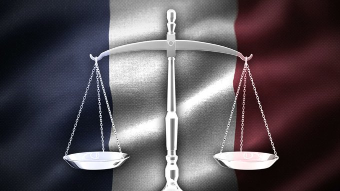 A silver scale of justice stands centered before the French tricolor flag (blue, white, and red), symbolizing the legal and regulatory action taken by France's gambling authority against the prediction market platform Polymarket.