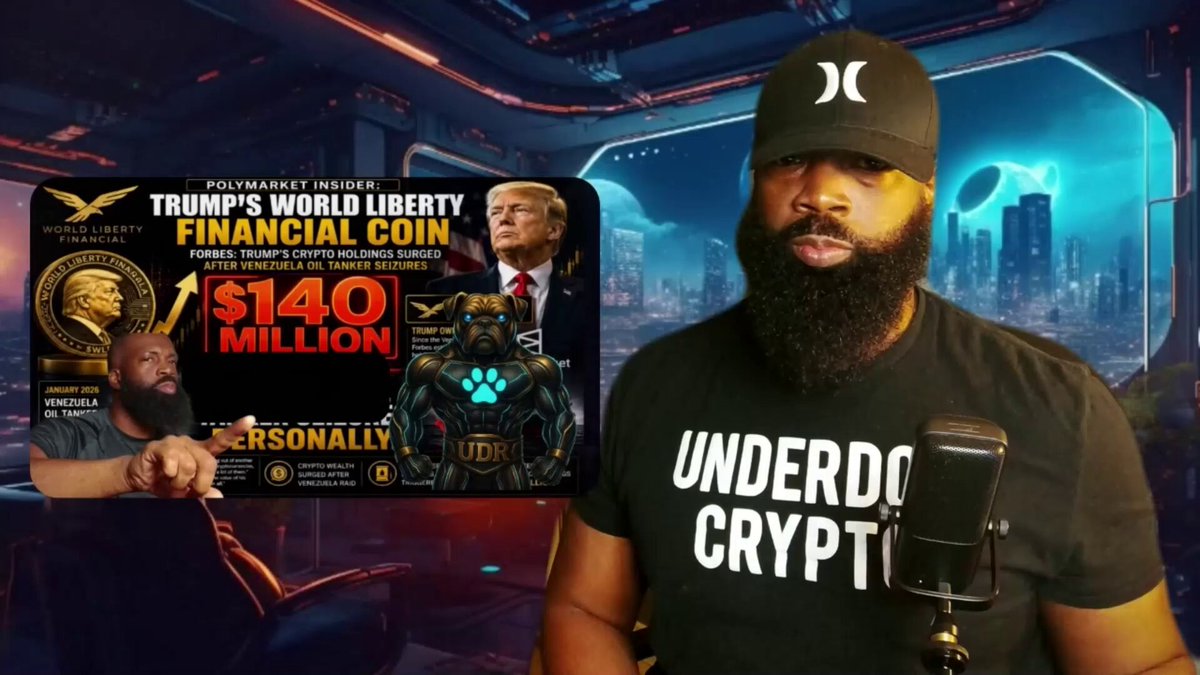 The image features a man with a beard wearing a black t-shirt that says "Underdo Crypt" and holding a microphone. The background of the image shows a city skyline, suggesting an urban setting or event location. In the foreground, there is a poster for a cryptocurrency called "Underdog Crypt". This poster highlights the potential benefits of investing in cryptocurrencies like Underdog Crypt, which can be used to fund projects related to compliance and blockchain intelligence.