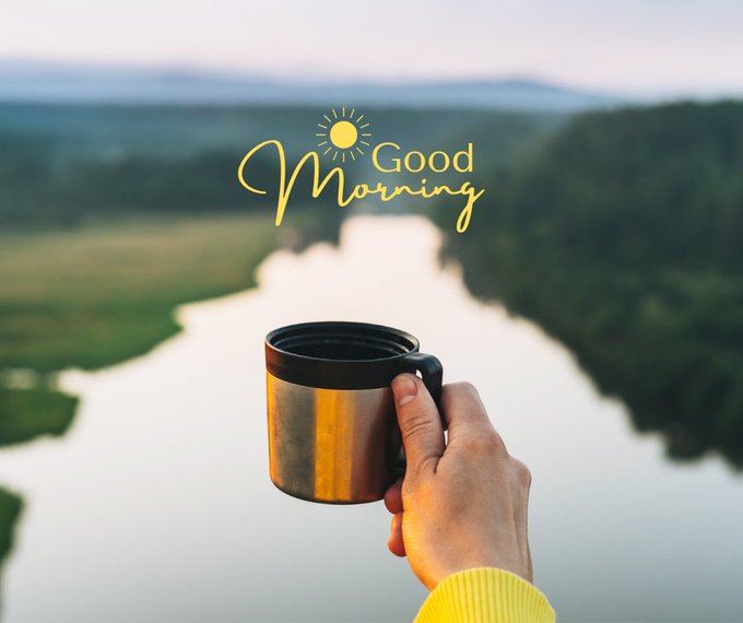 A hand holding a silver travel mug against a backdrop of a winding river and green hills, with the yellow text 'Good Morning' and a sun icon overlaid.