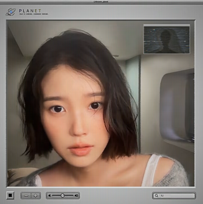 A young woman with short dark hair poses for a selfie or video call displayed within a 'PLANET' branded video player interface.