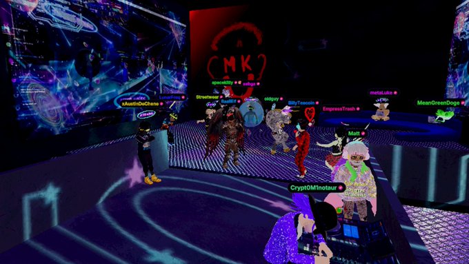 A screenshot of a virtual metaverse environment with various colorful avatars and usernames such as 'capitalKilly', 'LilYTeazer', 'EmpressTrash', 'CryptoDMihotours', and 'MeanGreenDoge' gathered in a dark space with neon lighting and digital displays.