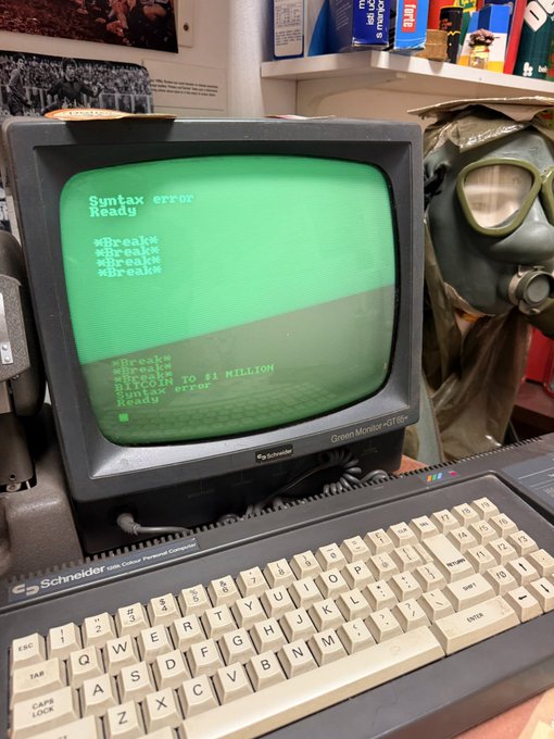 A vintage Schneider Green Monitor GT-86e computer displaying a green BASIC syntax error loop featuring '*Break*', 'Syntax error', and the message 'Welcome TO $1 MILLION'.