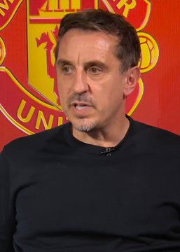 Gary Neville, former Manchester United defender and current pundit, appears on camera criticizing the team's lack of effort and movement off the ball, displayed in front of a Manchester United crest backdrop.