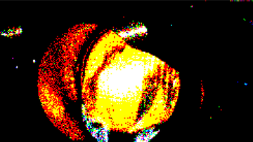 A highly pixelated, abstract image in red, yellow, and orange tones resembles a celestial body or organic shape against a black background. This visual likely serves as a symbolic representation related to the post's numeric value of "10.08."