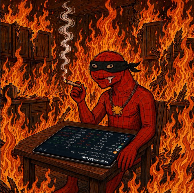 A cartoonish, satirical illustration of a Spider-Man-like figure wearing a mask and gold chain, smoking a cigarette while looking at a smartphone displaying cryptocurrency market data labeled 'ColchaManiaCoin' amid a fiery background.