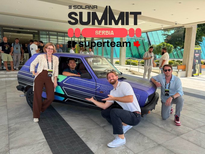 Three people pose in front of a purple custom car at the 'Solana Summit Serbia' event, with branding shown for 'Solana' and 'superteam'.