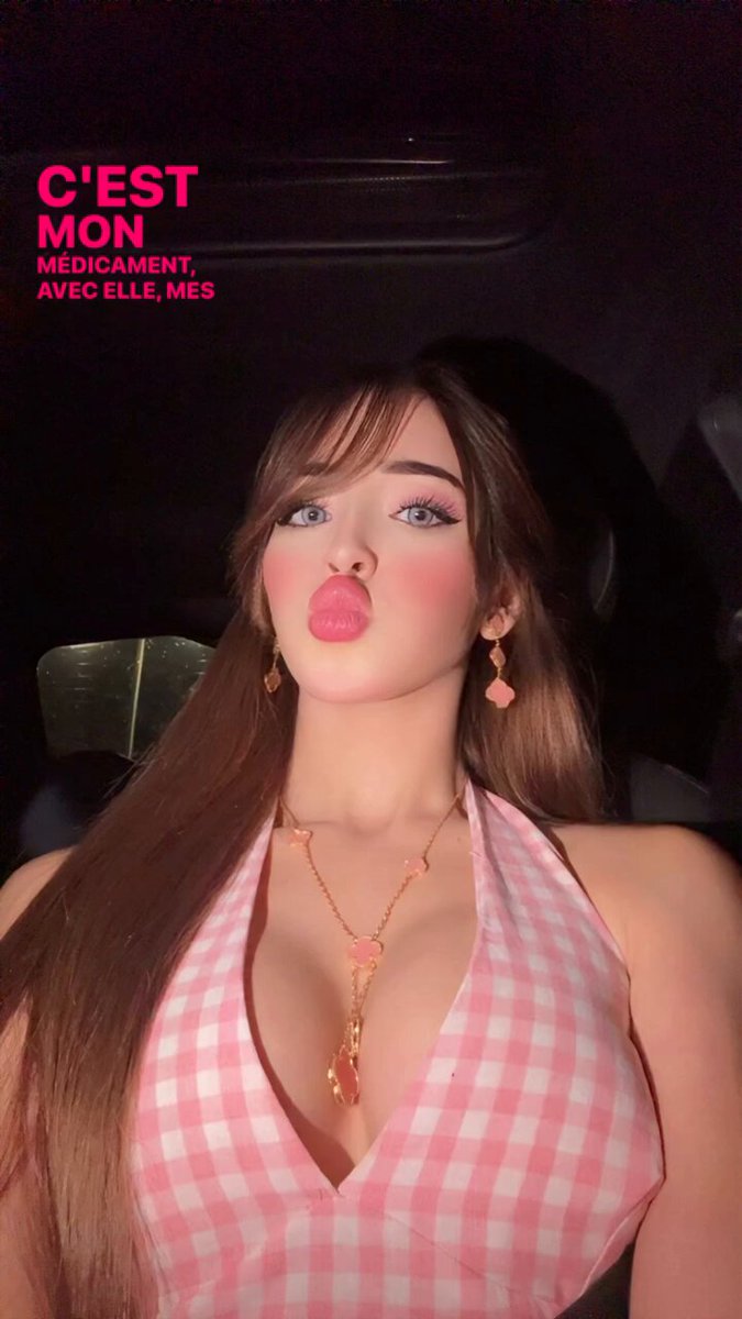 The image features a woman with long brown hair wearing a pink and white dress, making a funny face as she poses for a photo. The caption of the image reads "GOOD NIGHT 1. @quipnetwork is making reputation more meaningful by shifting focus from noise to real engagement signals Instead of empty activity, it's about consistent and contextual participation Web3 needs this kind of filter 2. What I like about @quipnetwork is how it". This means that instead of focusing on the number of followers or likes a post may have, the platform emphasizes creating meaningful connections with users by providing relevant content and engaging in authentic interactions.