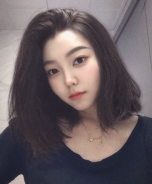 A young woman with long dark hair wearing a black top and a delicate necklace takes a selfie, her serene expression and softly lit face evoking the contemplative mood of the Mid-Autumn Moon Full message, which draws a poetic parallel between Bitcoin's fluctuating market recovery and the waxing and waning phases of the moon.