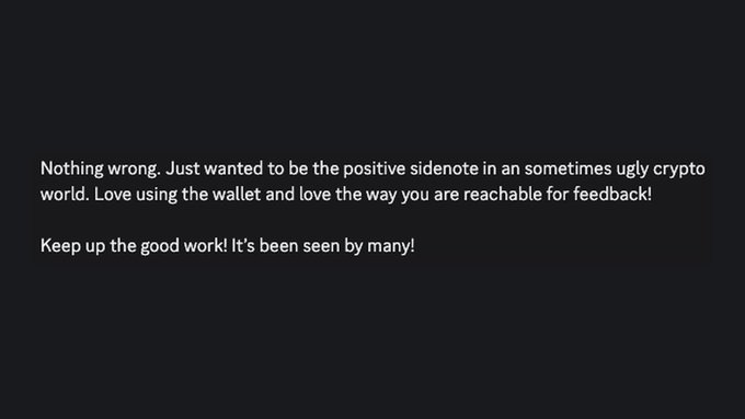 A dark screen displays a positive review text: 'Nothing wrong. Just wanted to be the positive sidenote in an sometimes ugly crypto world. Love using the wallet and love the way you are reachable for feedback! Keep up the good work! It's been seen by many!'