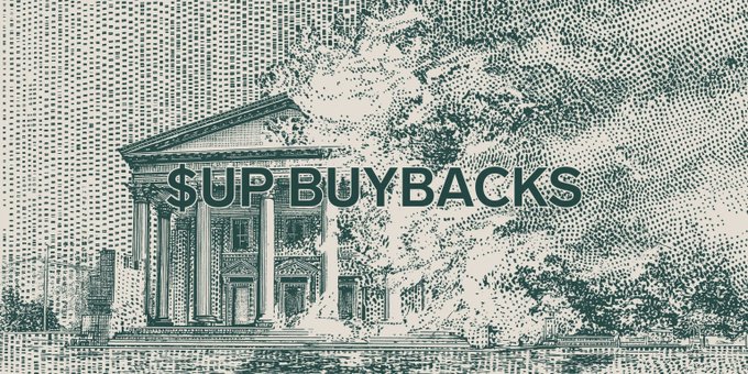 A stylized green illustration of a classical columned building—reminiscent of a bank or treasury—with the bold text "$UP BUYBACKS" overlaid, visually reinforcing the post's announcement of the protocol's automated $UP token buyback executed through Superform.