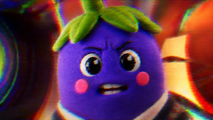 A purple berry-like cartoon mascot with green leaf hair and an angry expression appears alongside a Bitcoin logo in a colorful, distorted background. The image illustrates the post's playful coin-mascot pairing format, showing "Eggy" as the fictional character mascot while positioning Bitcoin as the asset being represented.