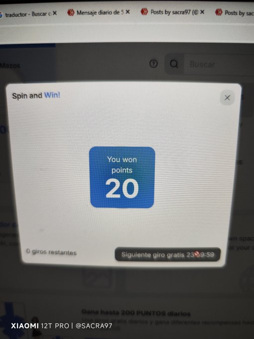 A computer screen displaying a 'Spin and Win' popup showing 'You won points 20' with Spanish text about free spins, watermarked 'XIAOMI 12T PRO | @SACRA97'.