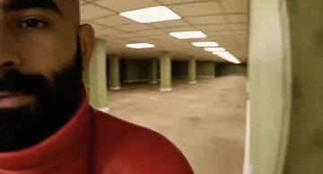 The image shows a man with a beard wearing a red shirt, standing in an empty room that appears to be a hallway or corridor. He has his face partially obscured by the camera's perspective, giving the impression of looking through a doorway into another space. The background is blurred and indistinct, drawing attention to the man and his surroundings. The caption "welcome to the solana backrooms." suggests that this room might be part of an office or workspace in the Solana building.