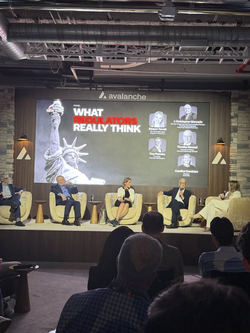 A panel discussion at an Avalanche-sponsored event titled 'What Regulators Really Think,' featuring speakers Eleanor Terrell, A. Christopher Gnutzmann, Timothy Massad, and Caroline Crenshaw.
