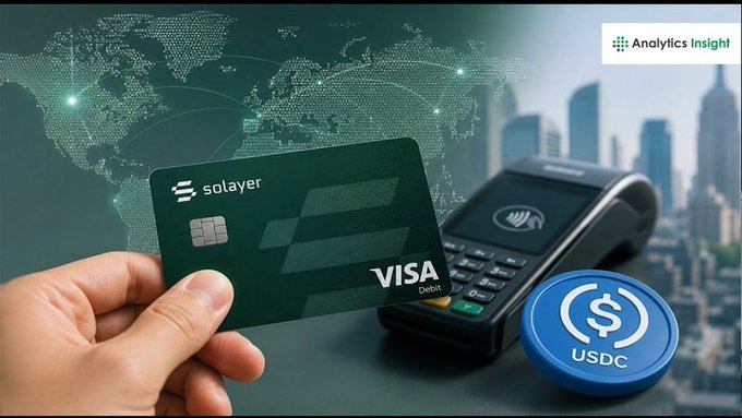 A hand holds a green 'Solayer' Visa Debit card next to a payment terminal and a USDC token, with a world map and city skyline background, branded by 'Analytics Insight'.