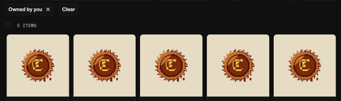 A digital inventory screen showing 'Owned by you' with 5 items, all appearing to be identical golden circular tokens with a letter 'E' design.