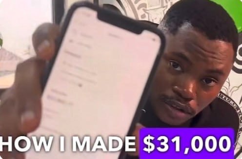 A young man holds up a smartphone displaying a screen while looking directly at the camera, with bold text overlay reading "HOW I MADE $31,000" in white and yellow lettering. The image serves as a thumbnail promoting a "Be the Boss" program where users can reportedly earn significant money by launching their own casino through a partner link.