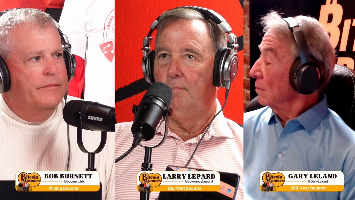 The image shows three men wearing headphones with microphones attached to their ears, each holding a microphone while talking into them. The background behind the men features a red wall that has the words "Petro-Sat" written on it. The text " Larry'S hair is on fire and after this episode your might be too".