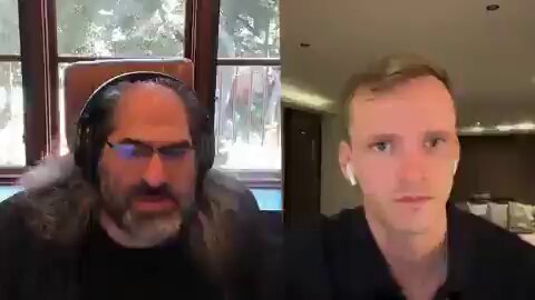 The image shows two men sitting next to each other, having a video call with their faces displayed on the screen. One man has long hair and is wearing glasses, while the other man has short hair and is dressed in black. They are engaged in a conversation about the cryptocurrency Ripple Ledger and its international adaptations. The post also mentions that there's an XRP Ledger app available for download.