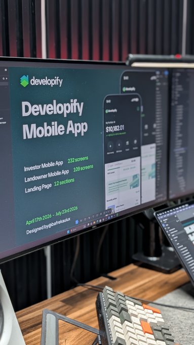 A Product Designer (UI/UX designer) standing proudly at their desk with their dual monitor setup displaying "Developify Mobile App" project covering an Investor Mobile App (232 screens), Landowner Mobile App (109 screens), and Landing Page (12 sections), running from April 17th to July 23rd 2025, designed by Babatunde, showcasing their completed work of over 300 screens for a user-friendly mobile interface system.