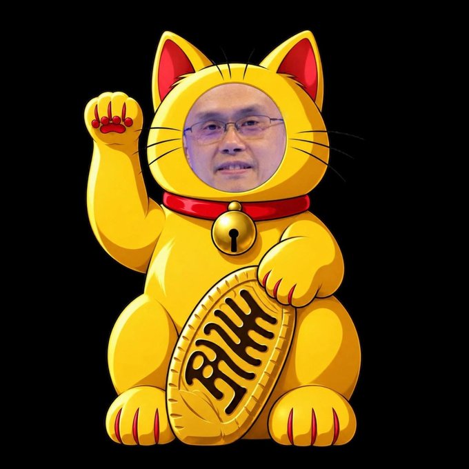 A maneki-neko (lucky cat) figure in yellow with a man's face photoshopped onto it, holding a Bitcoin coin featuring the Chinese character 福 (fortune).