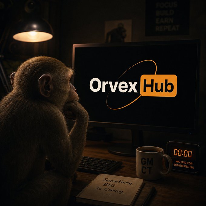 A monkey in a dark room gazes at a computer monitor displaying the 'Orvex Hub' logo, with a GMCT mug and a 'Something BIG Is Coming' note nearby.