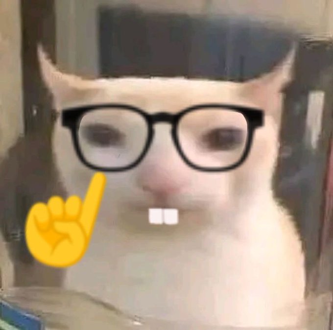 A low-resolution photo of a white cat edited with black-framed eyeglasses, two prominent front teeth, and a yellow pointing finger emoji overlay, with a blurry indoor background.