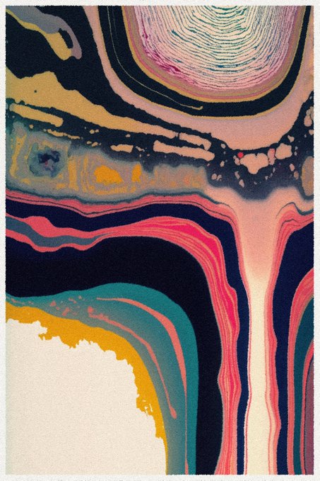 An abstract artwork with flowing, colorful swirls of pink, teal, black, gold, and white resembling a marbled texture.
