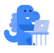 A blue cartoon dinosaur mascot sitting at a desk and using a laptop computer.
