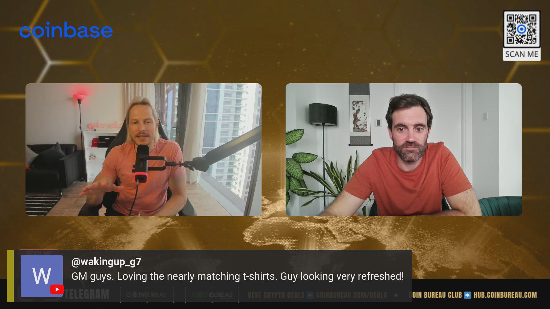 The image shows two men sitting at a desk with microphones in front of them, appearing to be having an interview or discussion. The background features a gold-colored hexagonal pattern that gives the impression of a large screen or projector. There are also some text elements on the image, such as "Coinbase" and "WalkingTheDog", which may provide additional context about the event taking place.