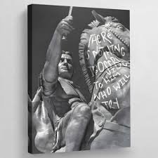A grayscale canvas artwork depicts a classical statue of a muscular figure holding a sign reading 'WERE ALL GOING TO DIE.'