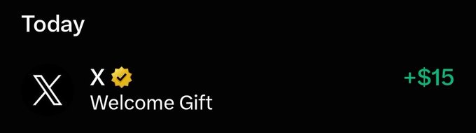 A notification from X (Twitter) showing a Welcome Gift with a verified checkmark, displaying a reward of +$15 in green text on a dark background.