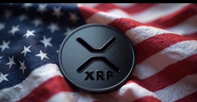 A black XRP coin rests on an American flag background, displaying the XRP logo and text.