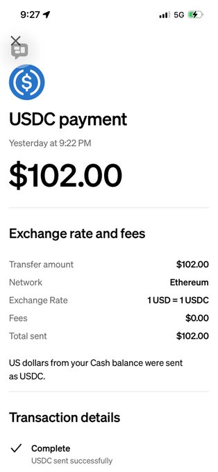 The image shows a cellphone screen displaying a text message with information about USDC payment, exchange rate, and fees for exchanging USDC into other fiat currency. A button is visible next to the message that says "Complete", indicating that the process has been finished, and the user should expect to receive their funds within 30 seconds.