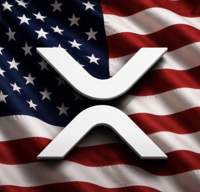 The white XRP (Ripple) cryptocurrency logo is displayed prominently over a draped American flag.