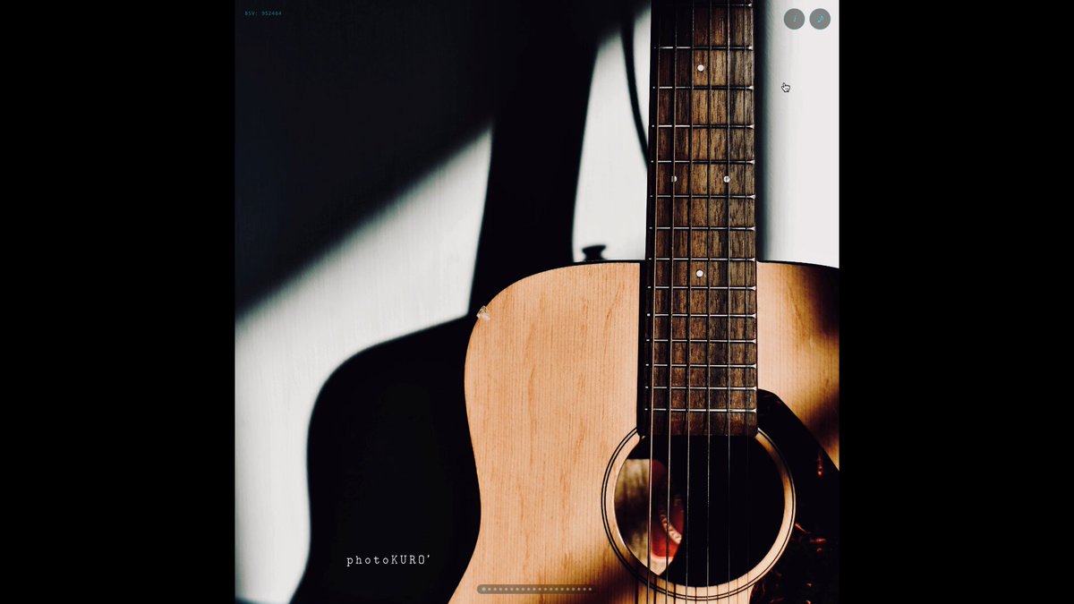The image features a wooden guitar with its neck extended upwards, resting against a white wall. The guitar's position and the shadow cast by the wall create an interesting contrast between light and dark areas. In the background of the image, there are two posts that appear to be related to Bitcoin or Ethereum. These posts contain text in Japanese, which might be discussing the current state of these digital currencies or their potential impact on the music industry. The overall scene suggests a connection between traditional art forms like playing the guitar and modern technology, such as cryptocurrency trading platforms.