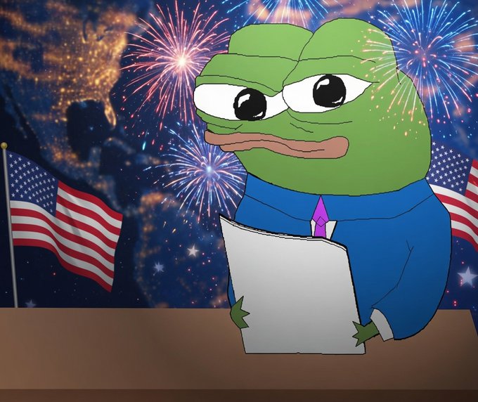A Pepe the Frog character dressed in a blue suit and pink tie holds a paper at a podium, set against a backdrop of American flags, fireworks, and a nighttime cityscape, evoking a July 4th-themed broadcast tied to "The Daily Degen" crypto newsletter mentioning tokens like $LIT, $ENA, $ANSEM, and $BTC.