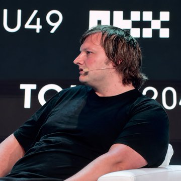Stani Kulechov, founder of DeFi protocol Aave, speaks at the TOKEN2049 conference in Dubai, discussing how decentralized finance may need to follow an "Uber path" to mainstream adoption following the Clarity Act's failure in the U.S. Senate.
