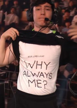 A man with a headset lifts his shirt to reveal a white undershirt reading "KELCEWAUS / WHY ALWAYS ME?" — a popular meme referencing NFL player Travis Kelce, humorously reflecting the "always me" sentiment of being on the losing end, fitting the post about Paper Rex's surprise defeat.