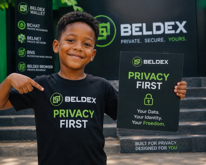 A young boy wearing a black 'BELDEX PRIVACY FIRST' t-shirt stands on steps pointing at the logo while holding a 'BELDEX PRIVACY FIRST' sign, with a Beldex product backdrop listing Beldex Wallet, BChat, Belnet, BNS, and Beldex Browser.