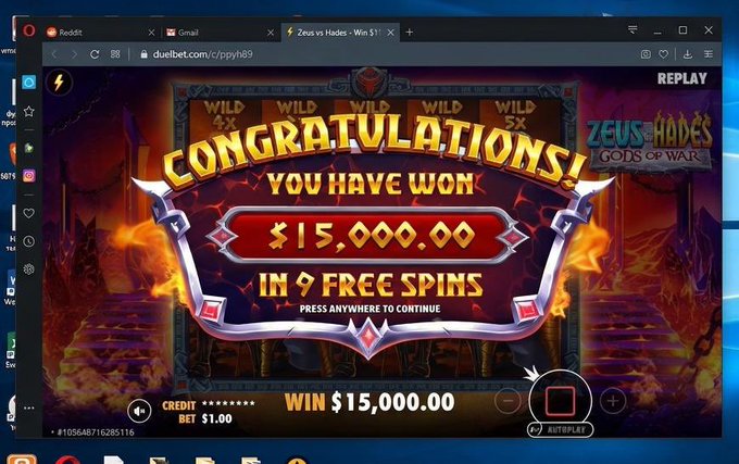 A screenshot of a slot game 'Zeus vs Hades: Gods of War' showing a 'CONGRATULATIONS! YOU HAVE WON $15,000.00 IN 9 FREE SPINS' notification.