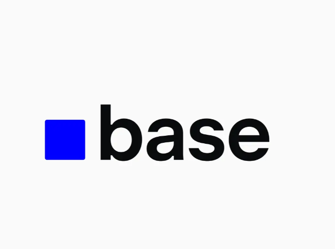 The image displays the Base logo—featuring a blue square next to the word "base" in black lowercase letters—representing the Coinbase-affiliated Layer 2 network that the post discusses in announcing its new Creator Grant Program offering up to $4,000 to independent crypto content creators.