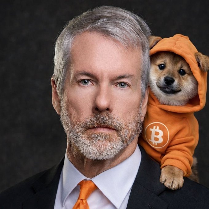 The image features a man wearing an orange hoodie with a dog sitting on his shoulder, both of them posing for a photo. The man has a beard and is dressed in a suit, while the dog is wearing a sweater that says "BTC". The background appears to be black, which contrasts with the vibrant colors of their outfits. The image also contains text elements such as "DOG DCA" and "MSTR", possibly indicating the subjects or themes of the photo.